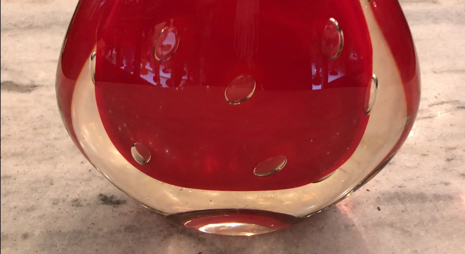 antique Murano vase with rounded shape and bright red color, subtle decorative details