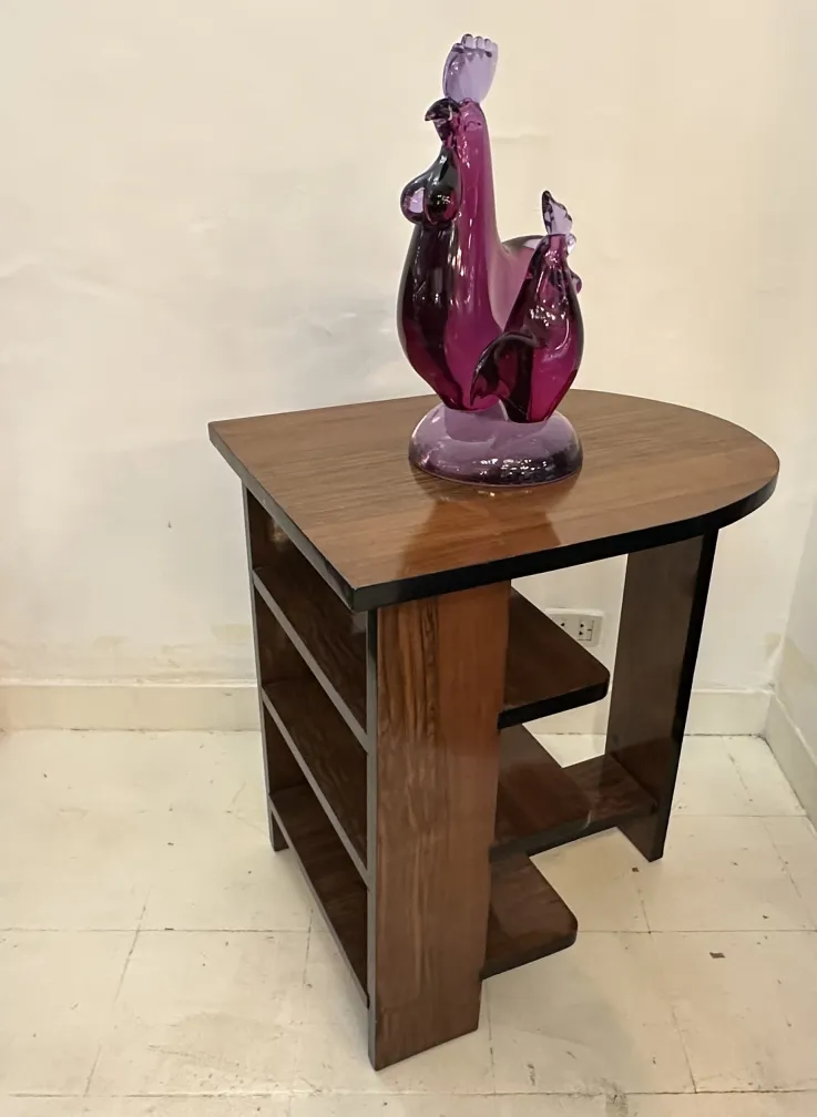 Antique Murano sculpture featuring decorative birds in purple tones, placed on a table