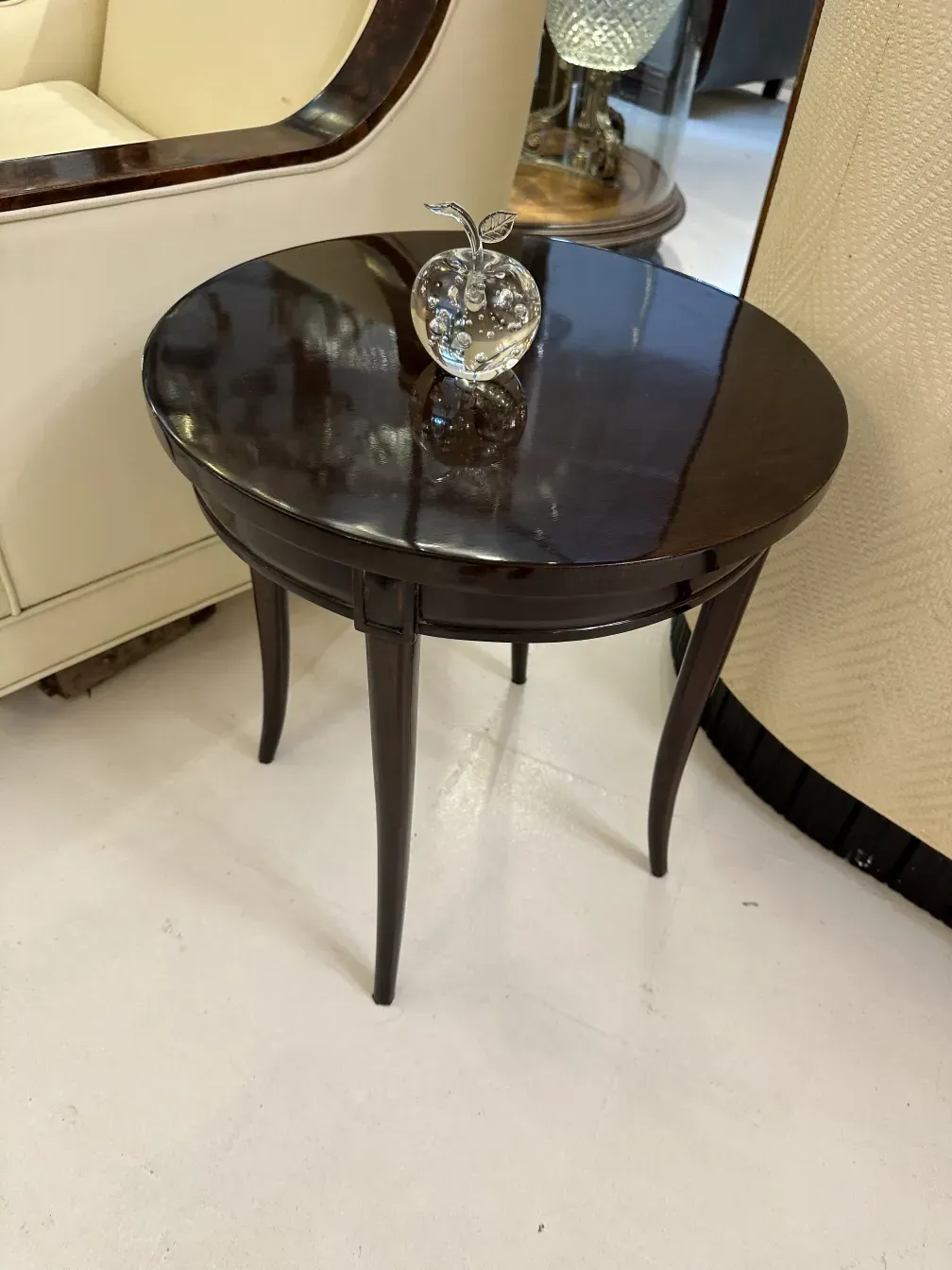 Top view of a Murano sculpture with a decorative apple on a table.