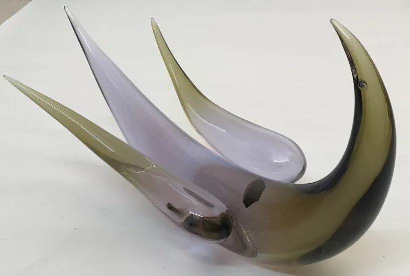Murano sculpture with grayish tones and transparency, elegantly curved.