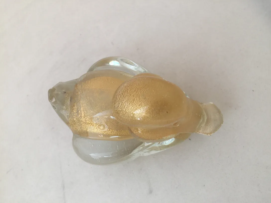 escultura de murano en tonos dorados y transparentes