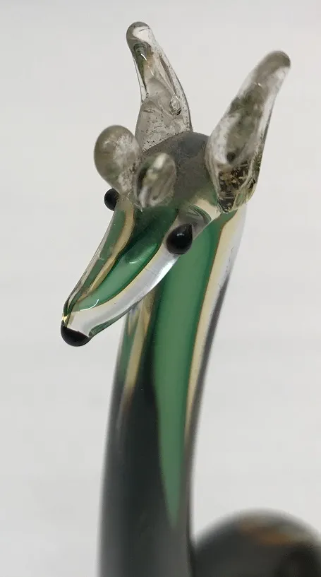 Antique Murano sculpture with vibrant colors and animal shape detail.