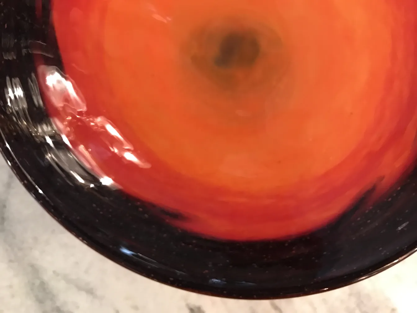 Glass signed by Schneider, displaying red and black hues.