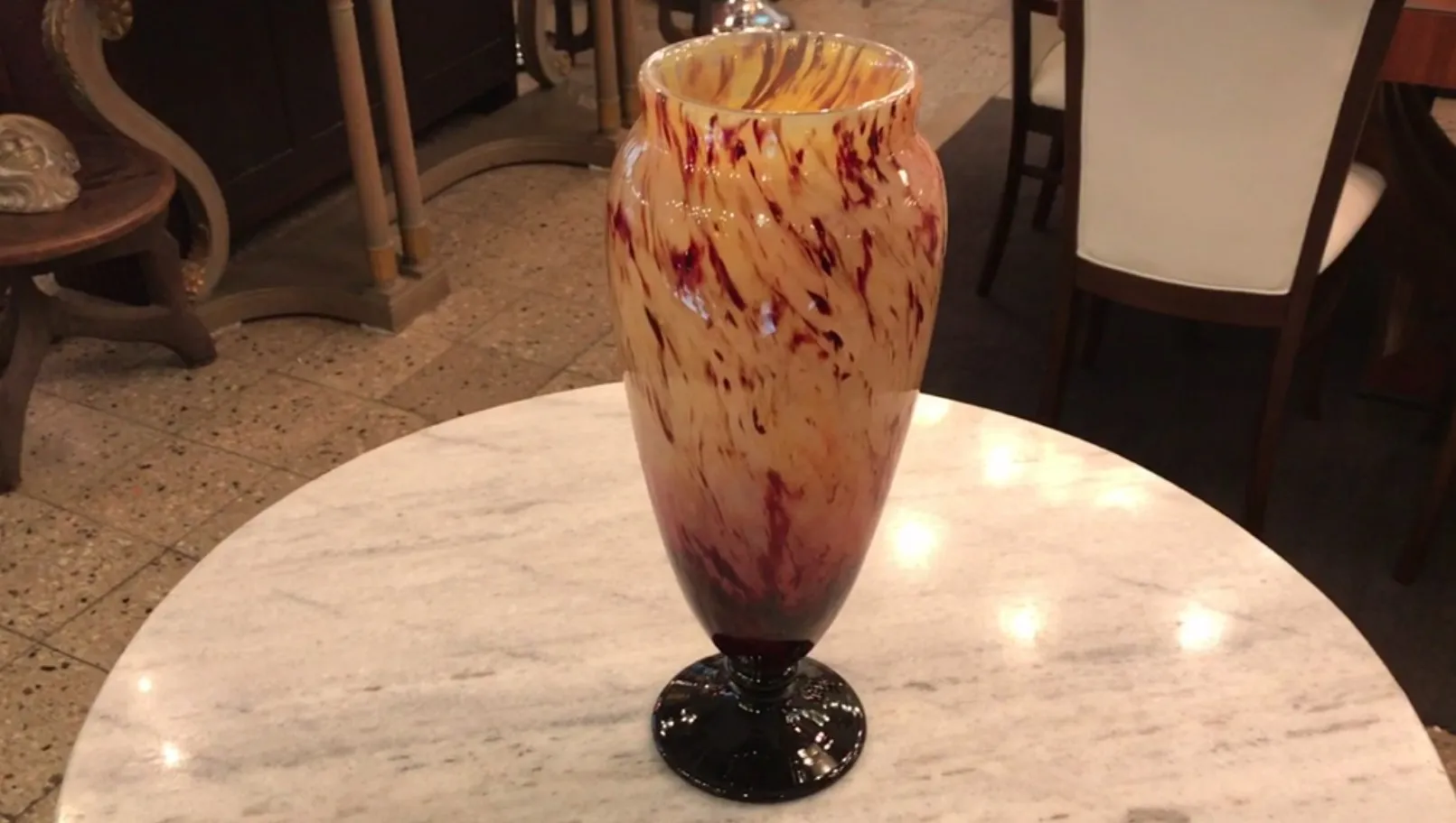 thick vase in yellow and red shades, black base