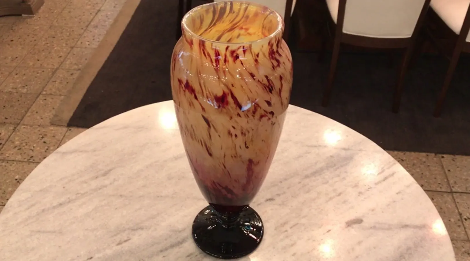 antique signed glass with warm decorative patterns