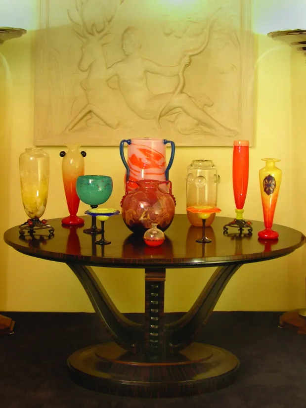 variety of antiques in glass with different shapes and colors