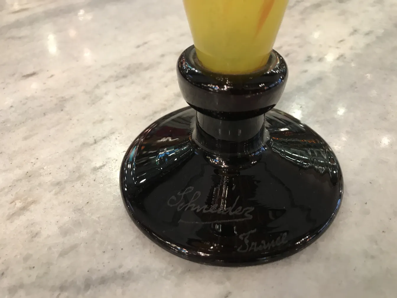 Signed glass by Schneider with black base, yellow decoration