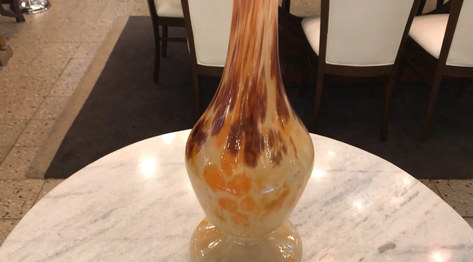 Signed glass by Schneider, decorated with ochre and brown tones.