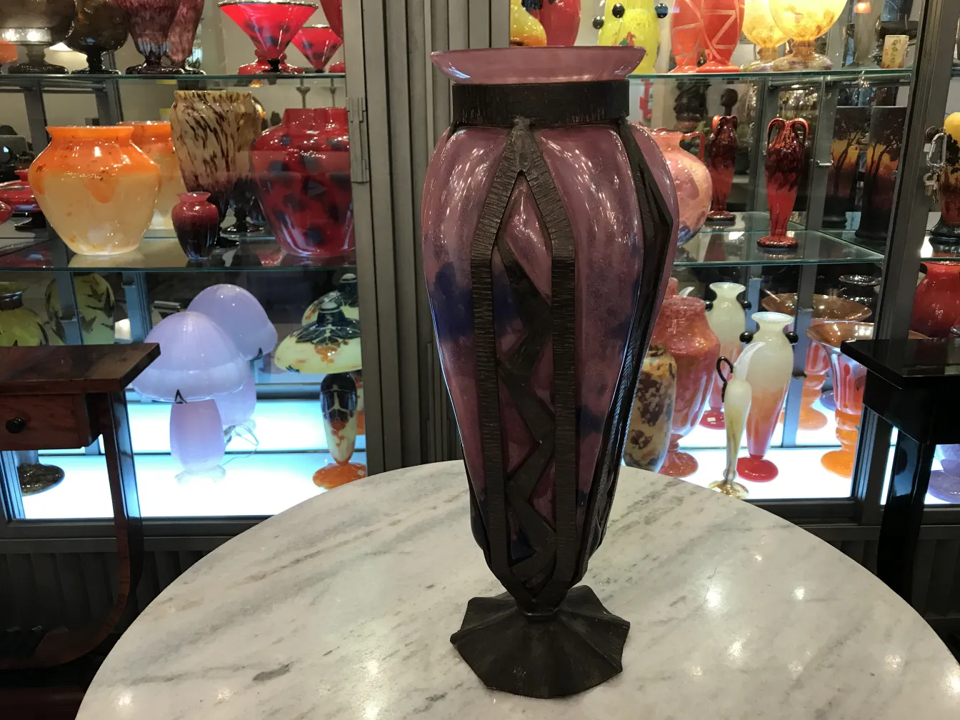 Antique: signed glass by Schneider, featuring pink hues and decorations in the backdrop.