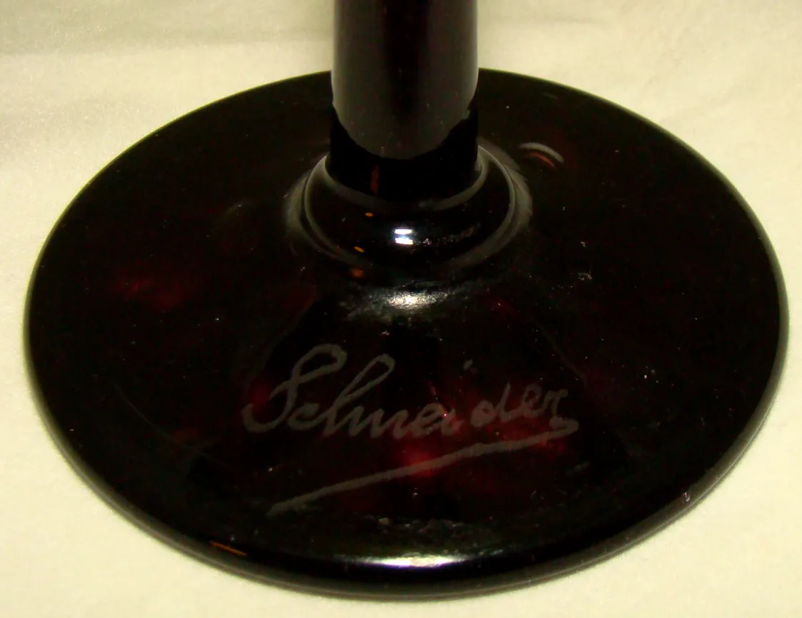 antique signed glass by Schneider with a black base