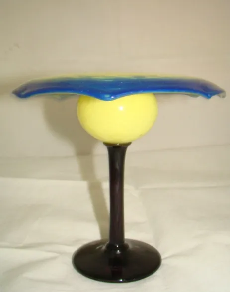 Signed glass with blue and yellow, dark base, antique style.