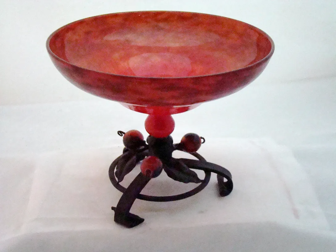 Antique signed glass by Schneider with French decoration, on a decorative stand.