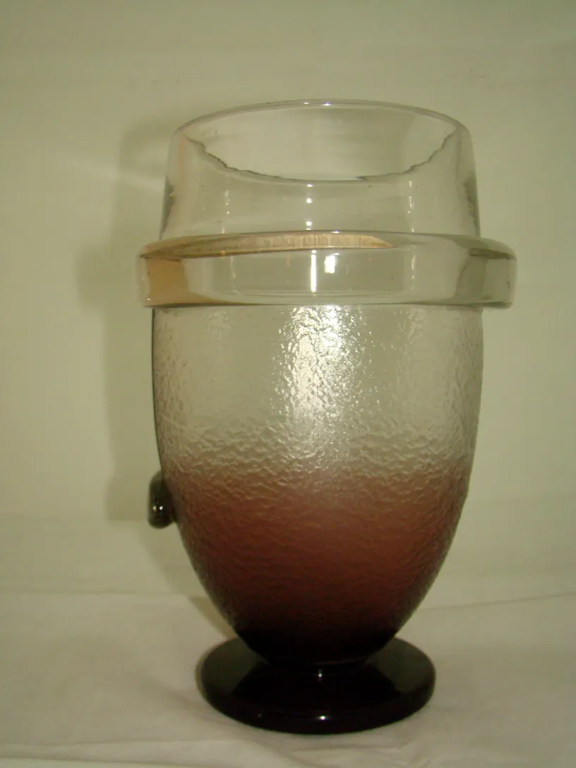 Antique signed glass by Schneider featuring light tone design