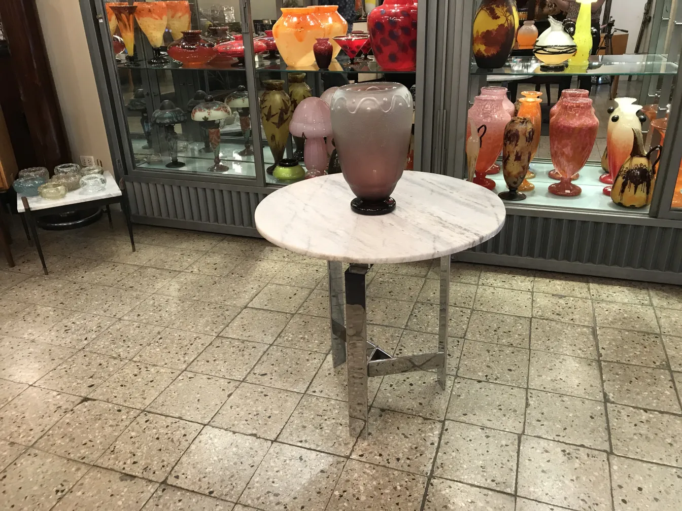 SIGNED GLASS Schneider on a table with other antiques