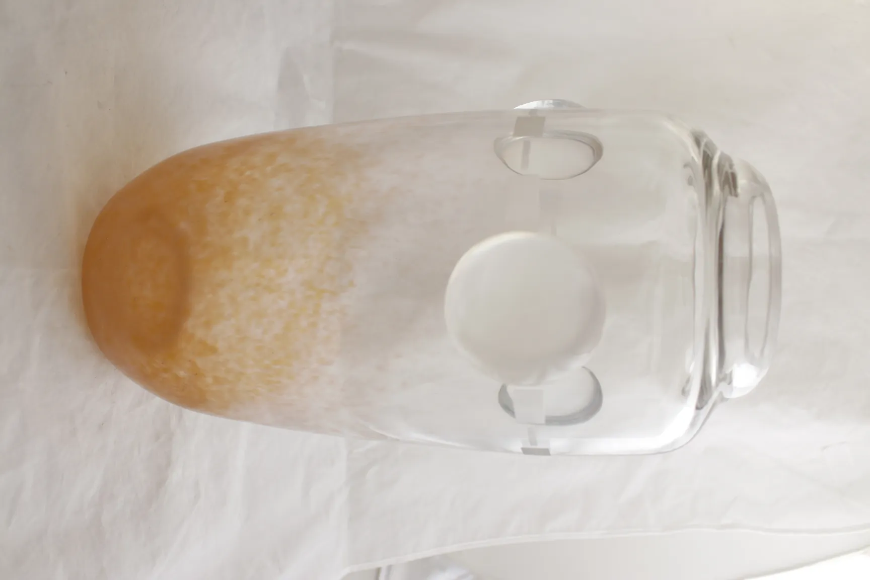 signed glass by schneider featuring unique shape and color details