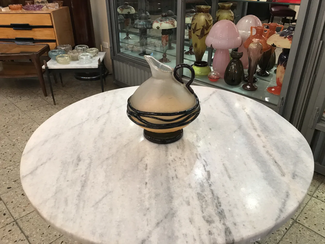 antique signed glass with distinctive Schneider details, surrounded by antiques