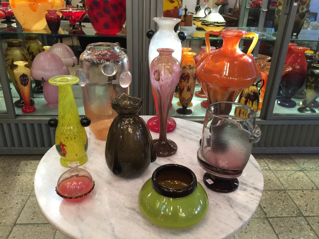 various vintage colorful glass vases on display