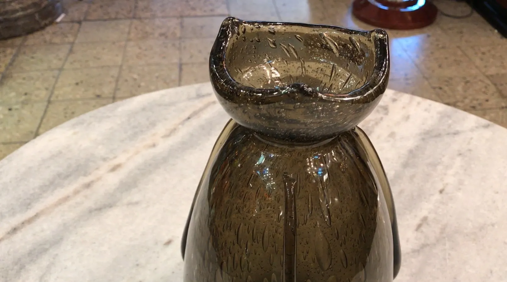 antique glass signed by schneider with visible droplets