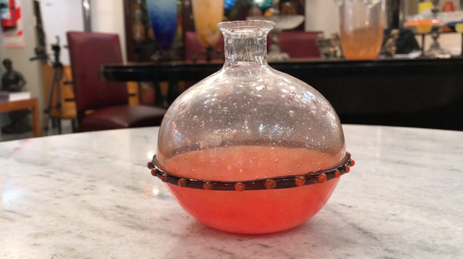 signed glass schneider in an antique setting with bubbles