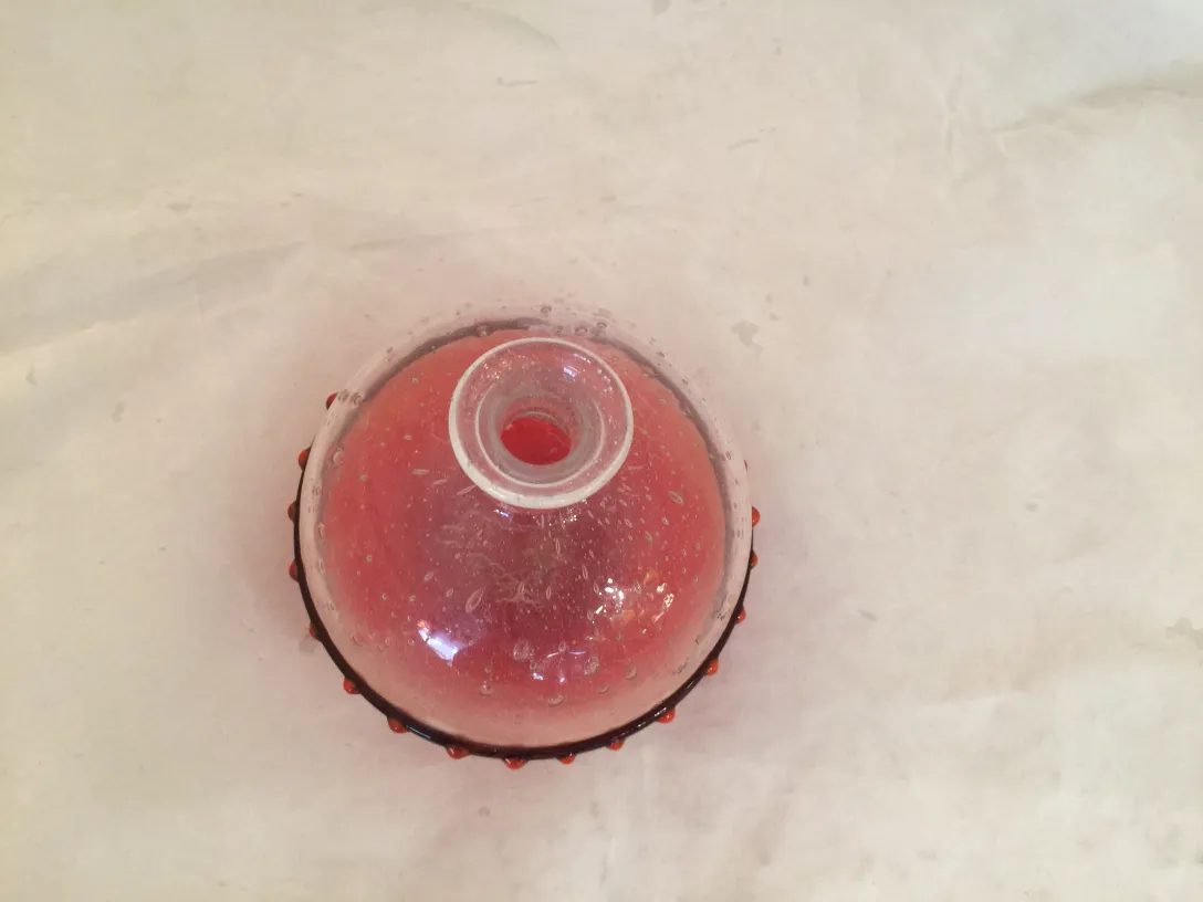 antique glass piece with bubbles and elegant design