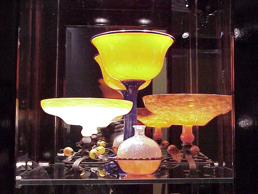 Collection of antique signed glass by Schneider in various shapes and colors