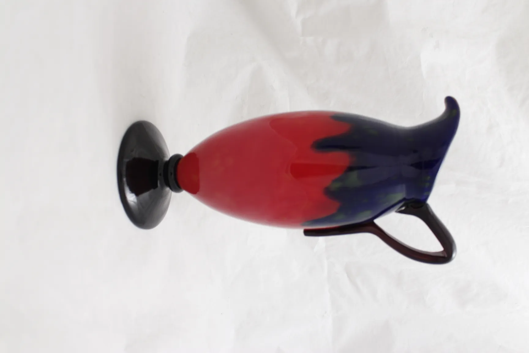 antique signed glass with a red and blue design.