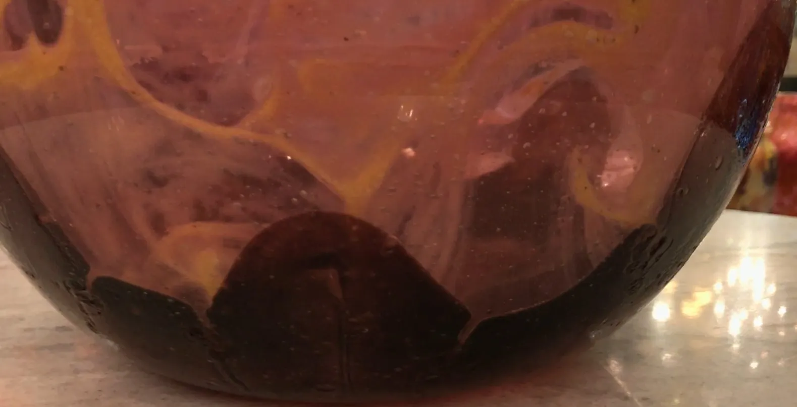 antique glass with vibrant design and Schneider's signature