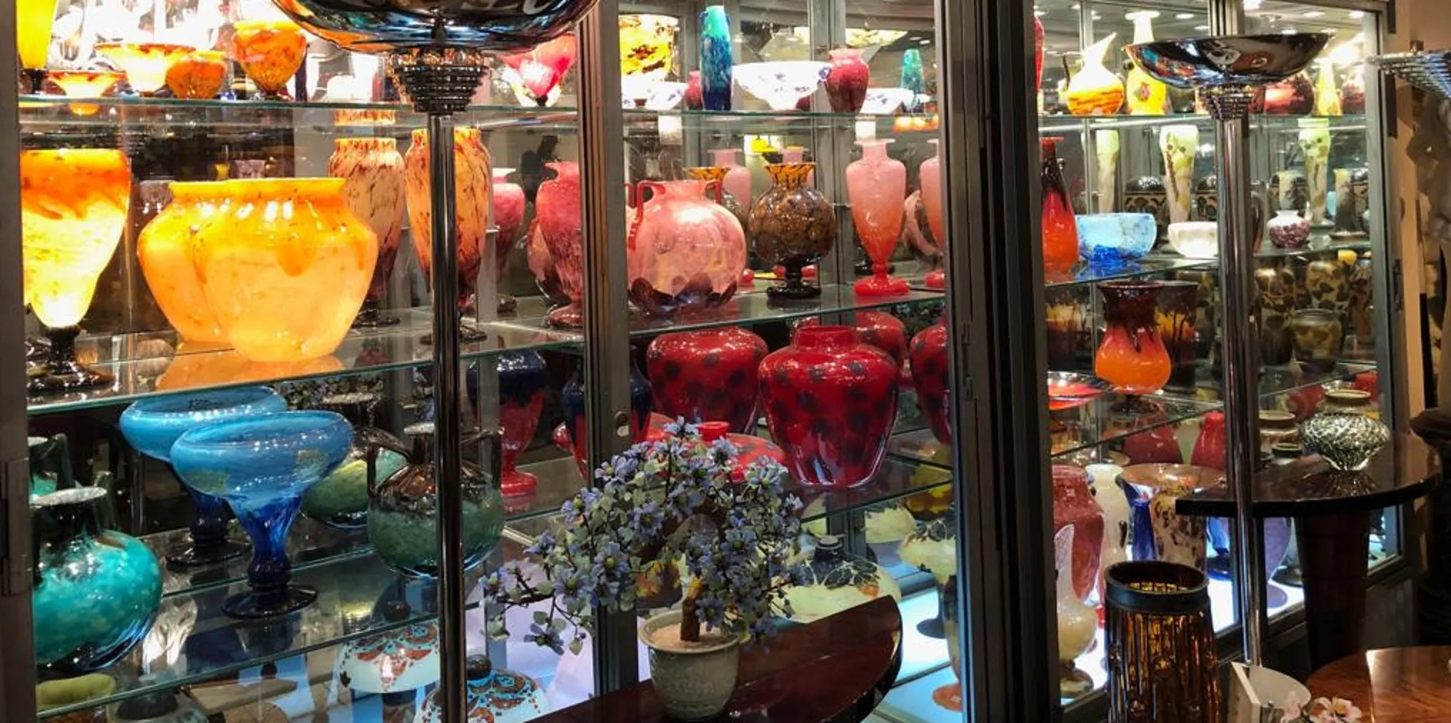 Collection of antiques featuring signed glass Schneider in various colors