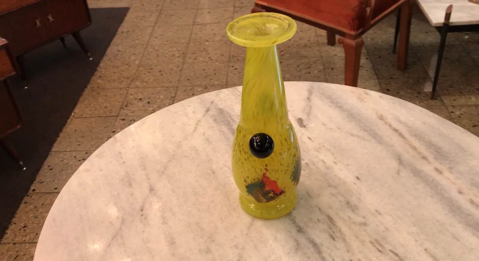 Yellow signed glass with decorative design