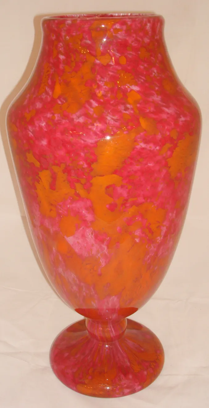 decorative glass in pink and orange hues, footed base