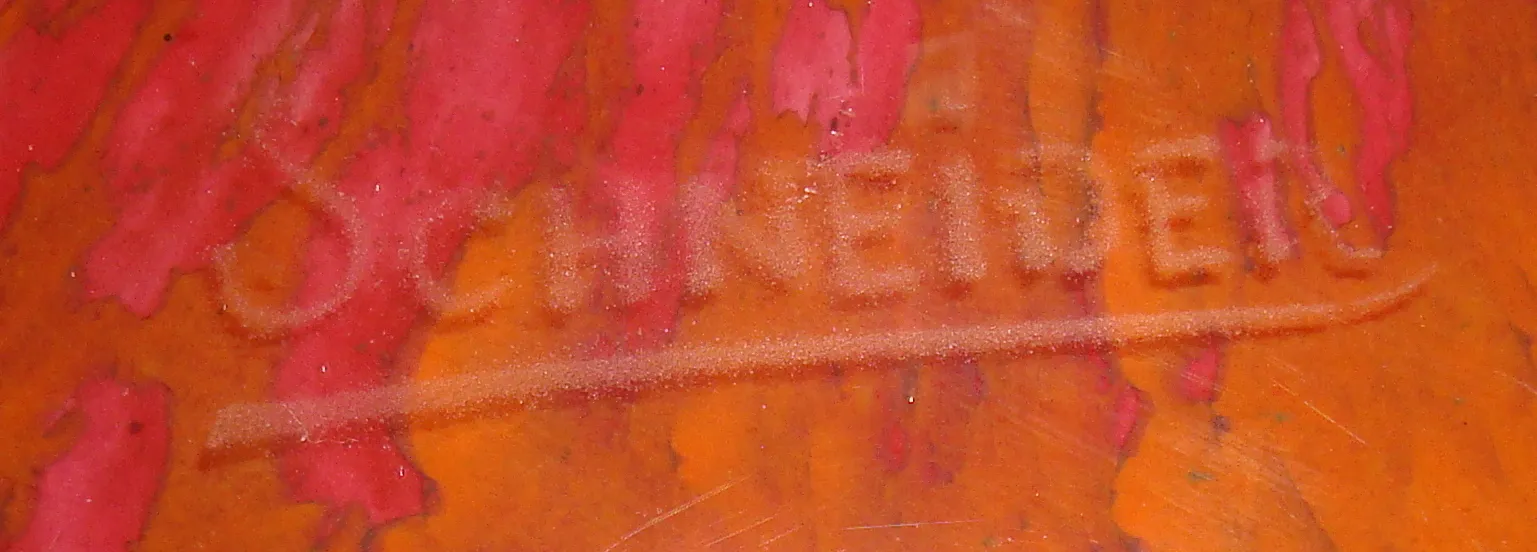 Antique glass with Schneider's signature, vibrant colors and decorative details.