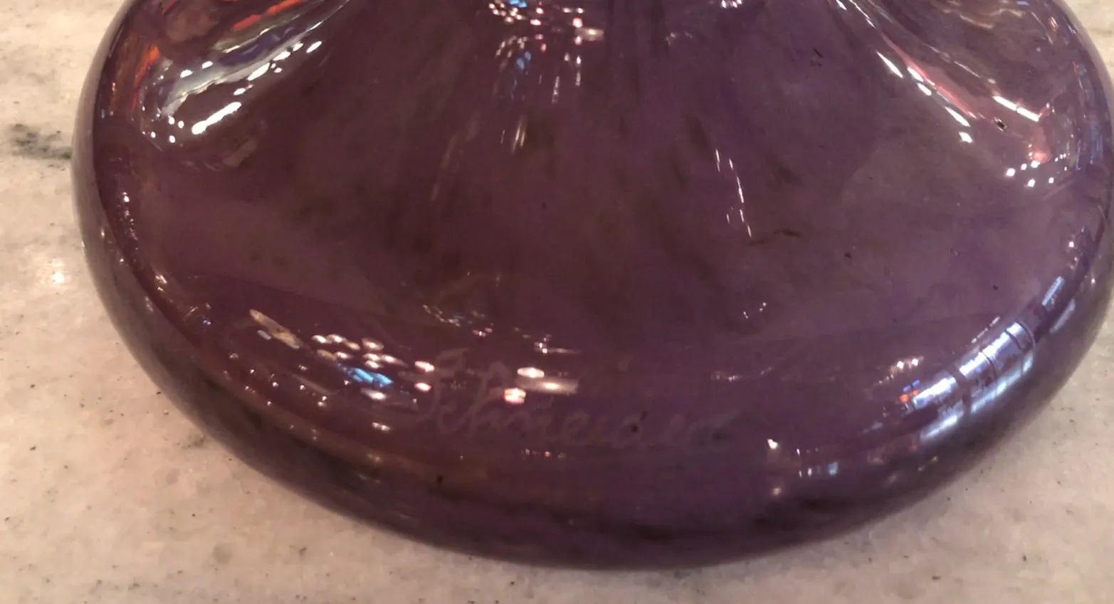 Purple signed glass by Schneider with visible signature