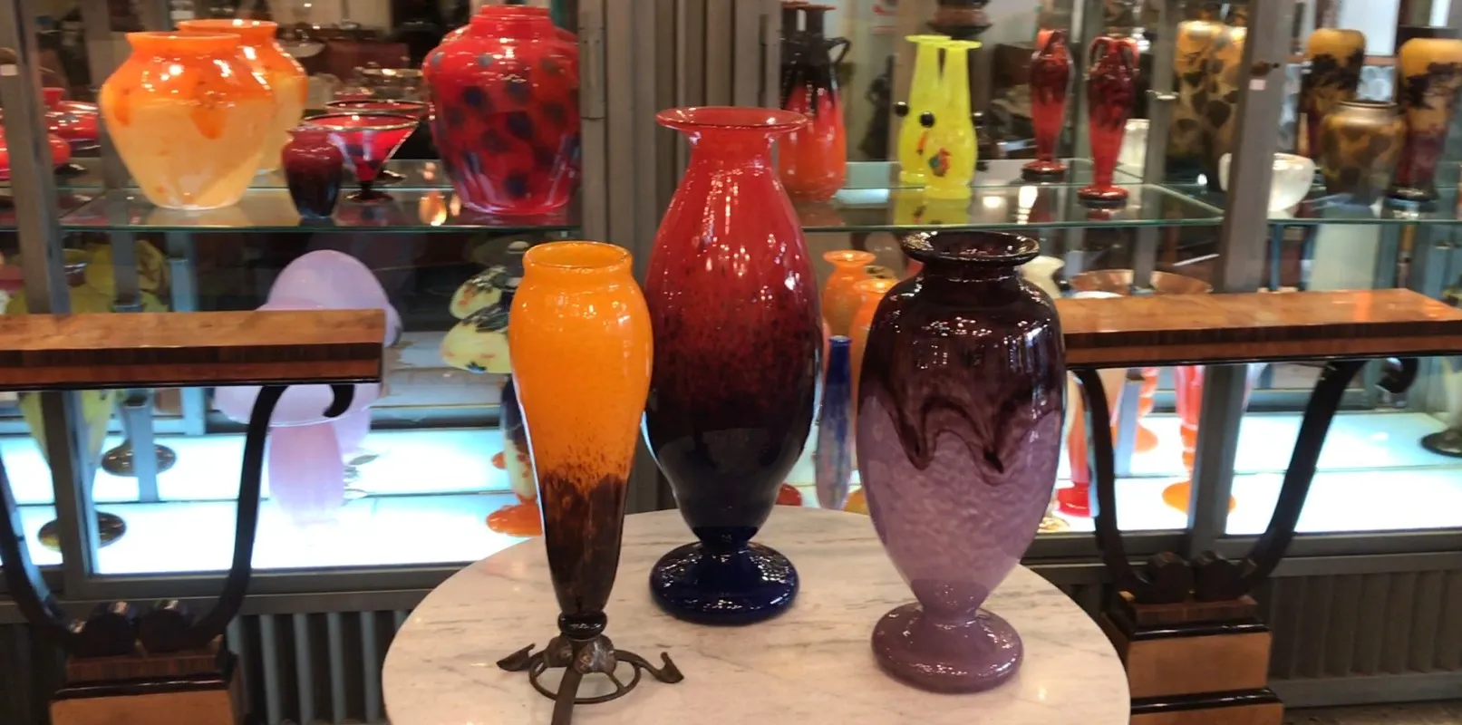 signed glass with vibrant hues in an antique setting