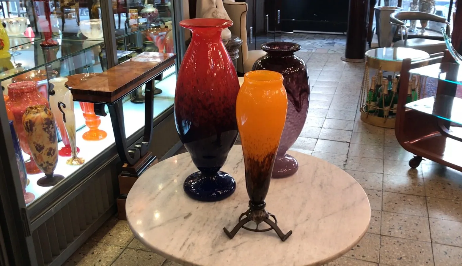 Three antique glass vases on a table
