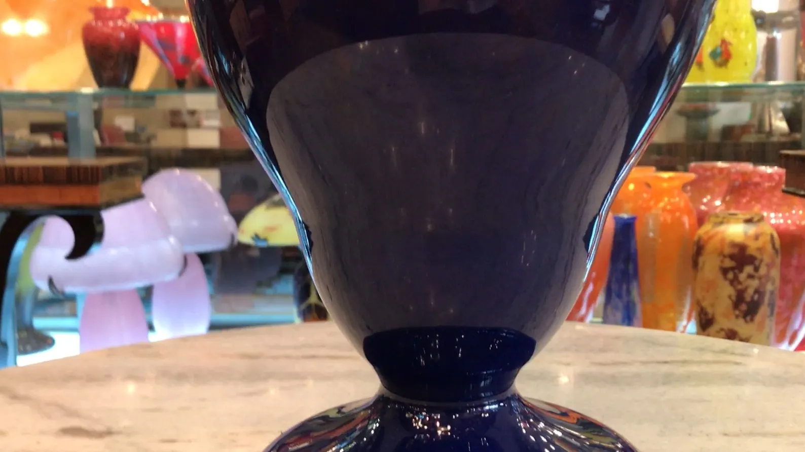 Schneider signed glass in a colorful antique setting.