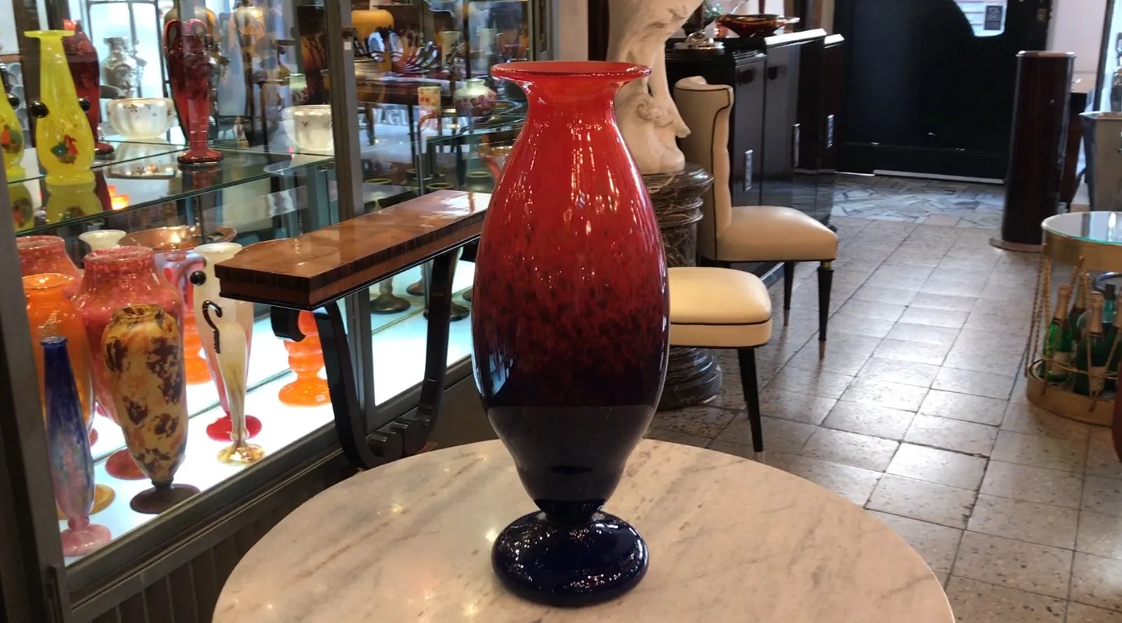 antique vase of signed glass schneider french in a decorative setting