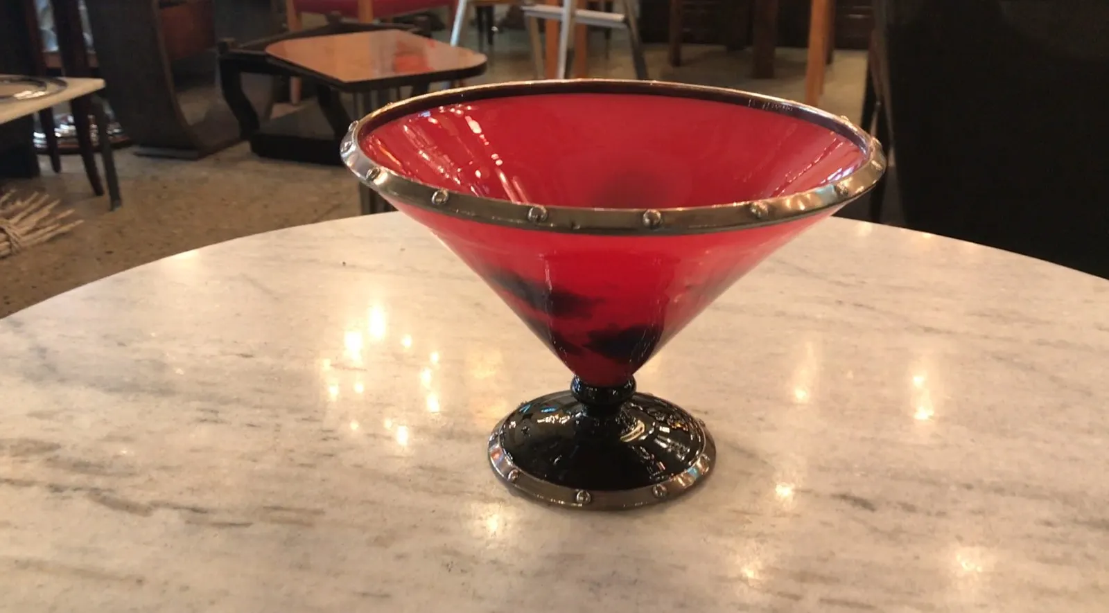 signed glass with metal border, red and black base