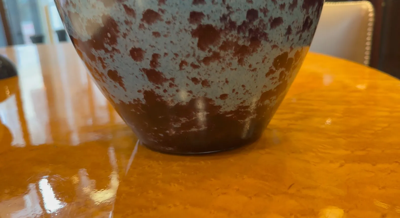 Antique signed glass by Schneider featuring unique details.