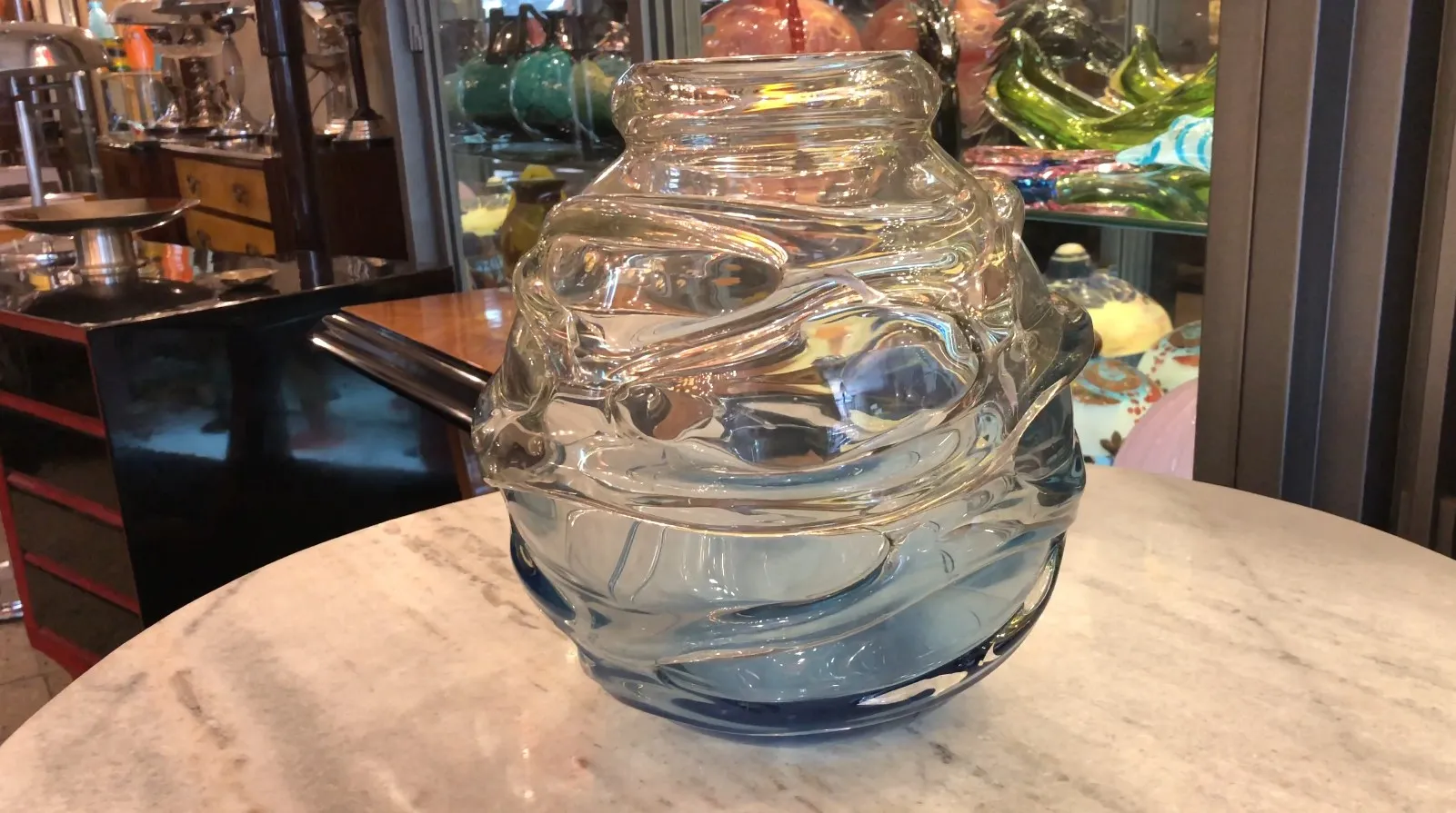 signed glass with wavy design and blue base, antique