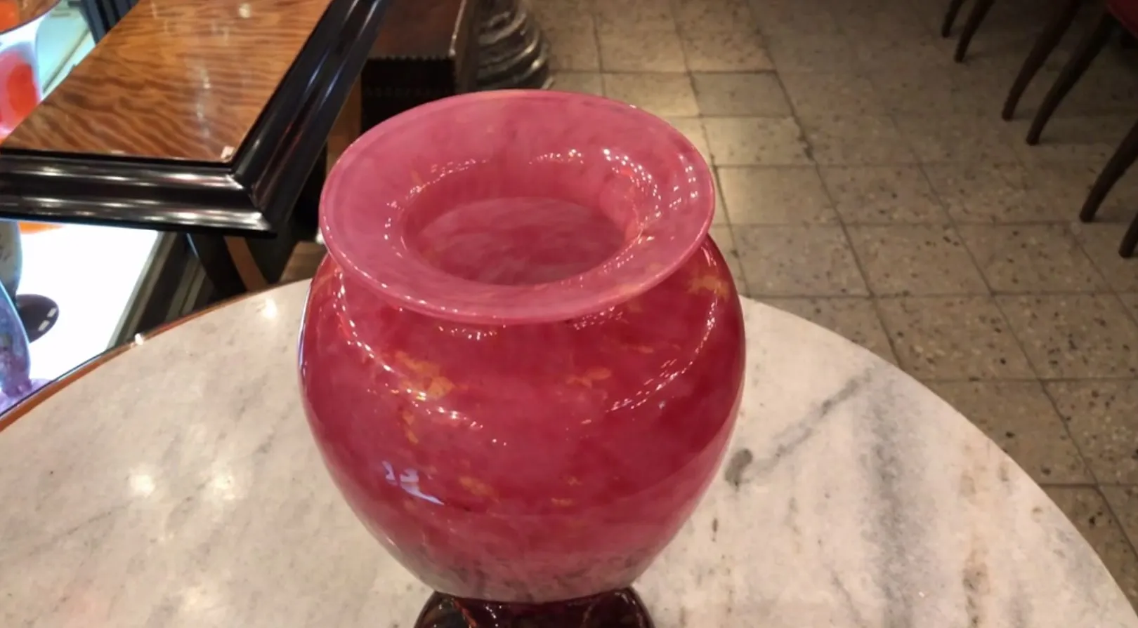 antique glass vase with pink hues and golden details, marble background