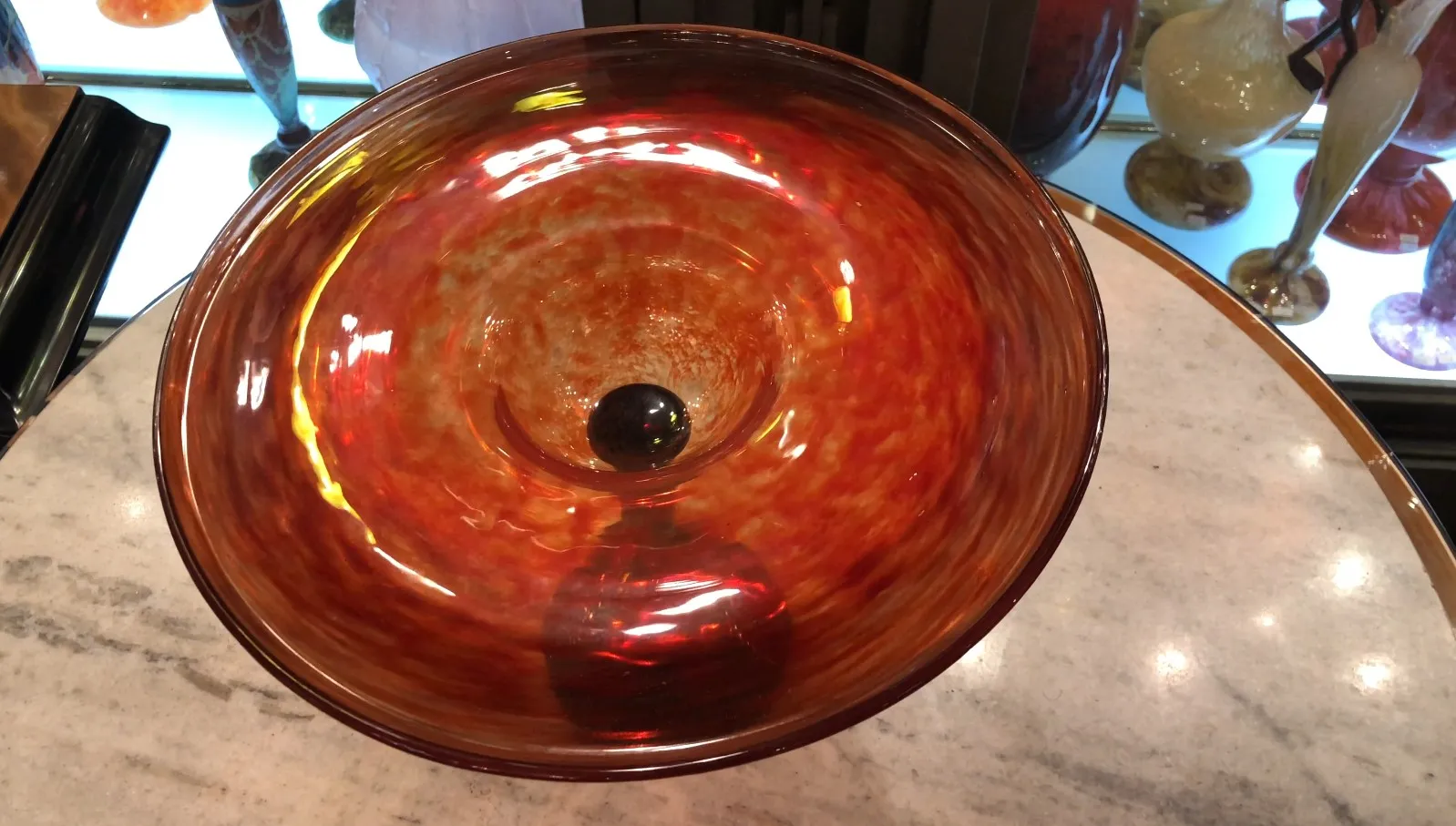 colorful circular signed glass with a unique design