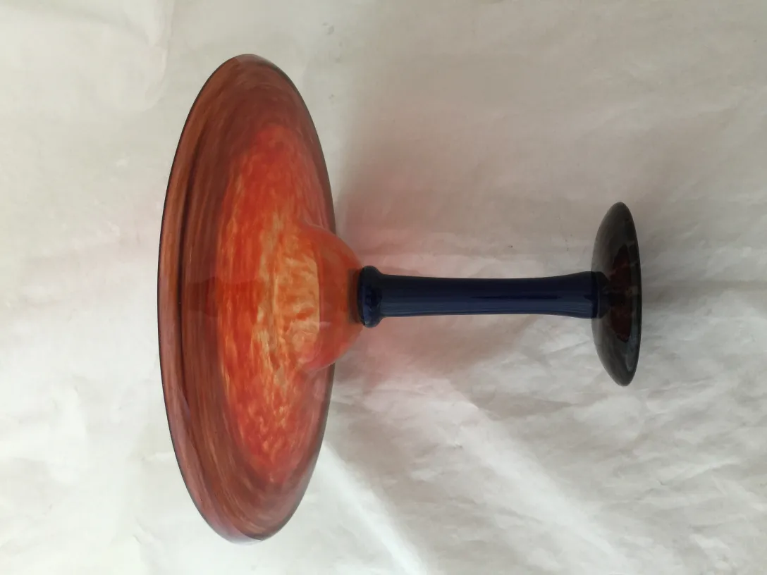 Antique signed glass by Schneider, featuring vibrant colors and polished detail.