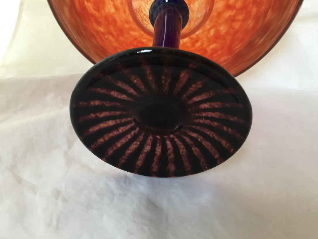 Antique glass with signature, dark base, elegant design. Attractive setting.