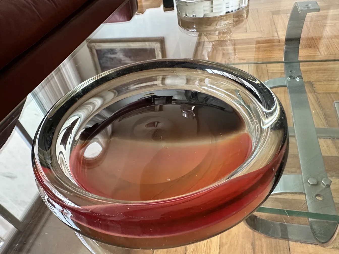 beautiful antique murano glass with red and clear tones, decorating an elegant setting