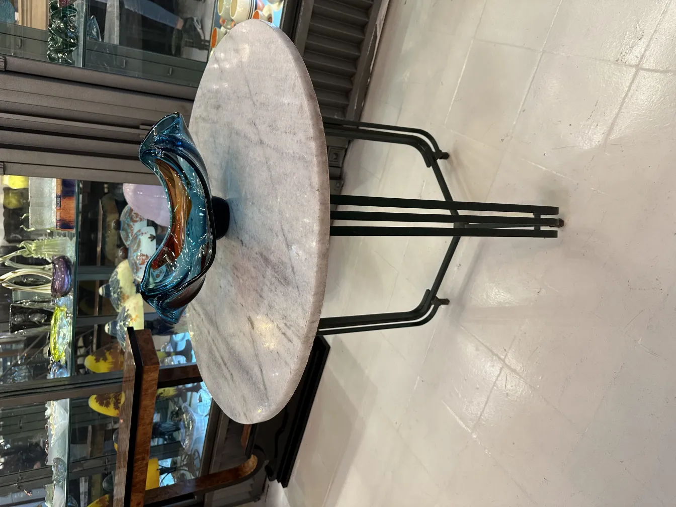 murano glass decoration in abstract shape with blue and brown tones, on table