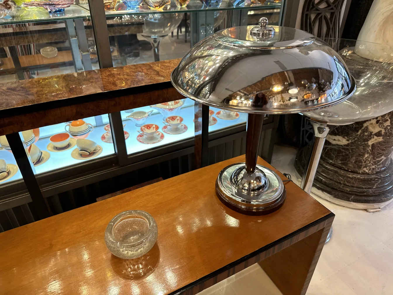 Antique Murano glass with bright lights and porcelain background.