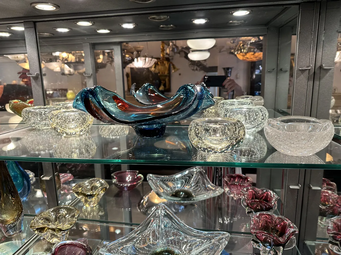 antique murano glass with vibrant colors and elegant shapes, surrounded by other decorative antique items