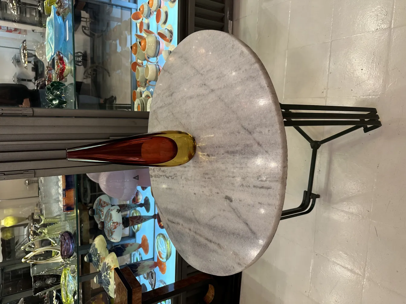 amber and gold vase on marble table