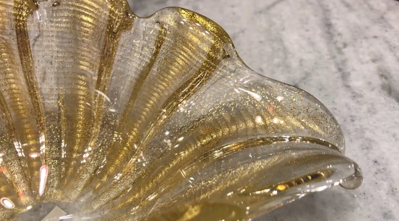 beautiful murano glass with a golden finish and wavy texture
