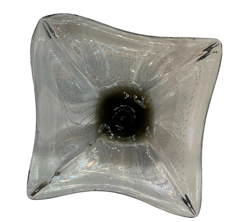 decorative dish shaped like a flower with dark center